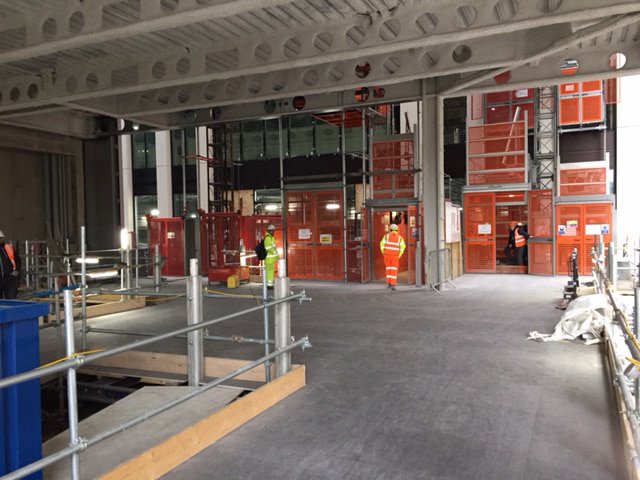 RECO Loading Docks connecting Alimak passenger hoists at Canary Warf construction site in London