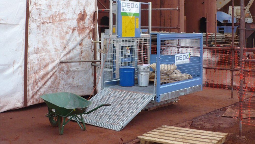 A GEDA 500Z Goods hoist ready to be loaded with construction materials