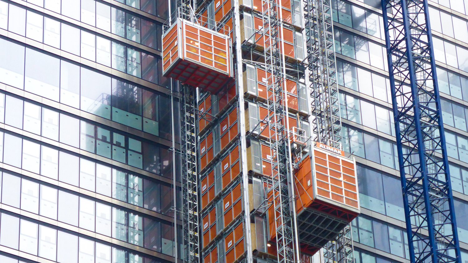 RECO Common Tower supporting an Alimak Scando and a Stros Mammoth passenger goods hoist at the Landmark Pinnacle in London