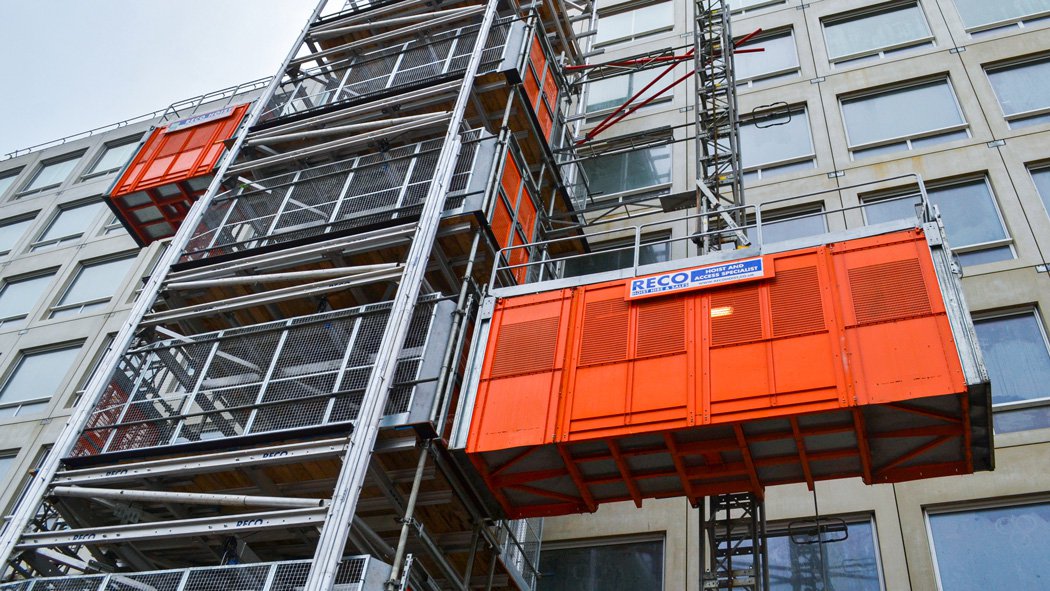 RECO Common Tower supporting 3 Alimak Scando passenger goods hoists at high-rise construction site